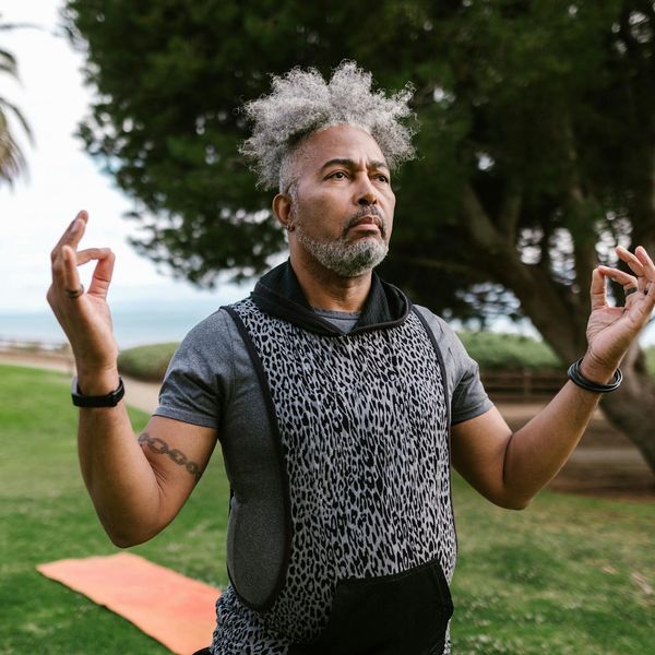 Person meditating in a serene environment, focusing on inner balance.